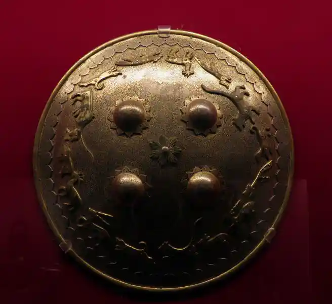 Shield with four suns and animals all around